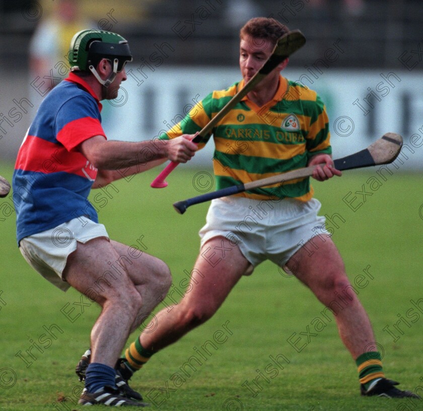 44538 -1340785580 
 Erins Own Timmy Kelleher looking for a way past Blackrock player John Smnith during their S.H.C. match at Pairc Ui Chaoimh.Picture Dan LInehan
