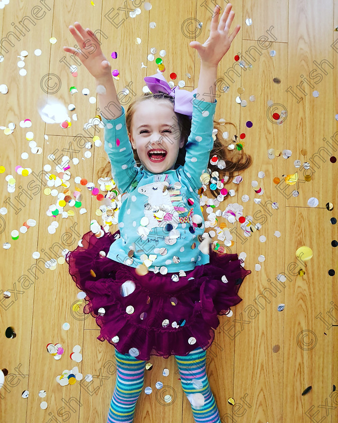 IMG-2a62942ab534381861675880595d5a3b-V 
 Eva Murphy, four years old, playing in confetti after popping her big brother Leo's birthday balloons, at home in Maynooth, Co. Kildare. 
Picture: Heather Murphy