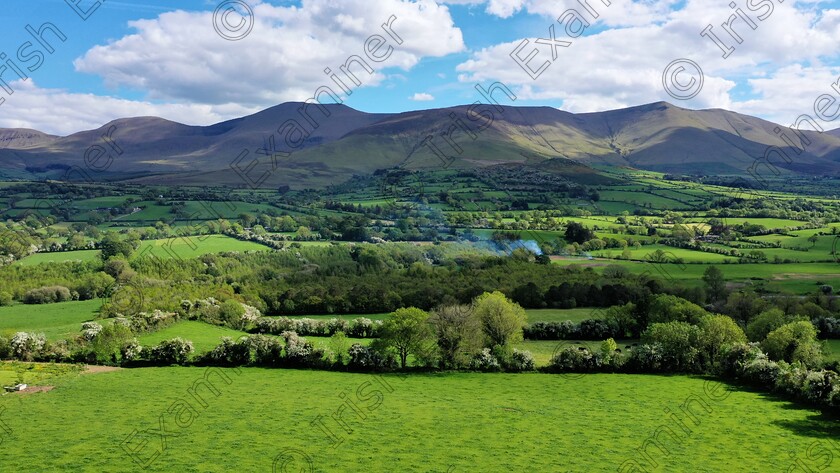 DJI 0039 2 
 A landscape photo that was captured by myself, Jim Owers recently on my walking adventures in the Glen of Aherlow. Showing the mighty Galtee Mountain range. Galtee Mor at 919 metres above sea level features centre of shot. Green pasture land dominates the foreground.