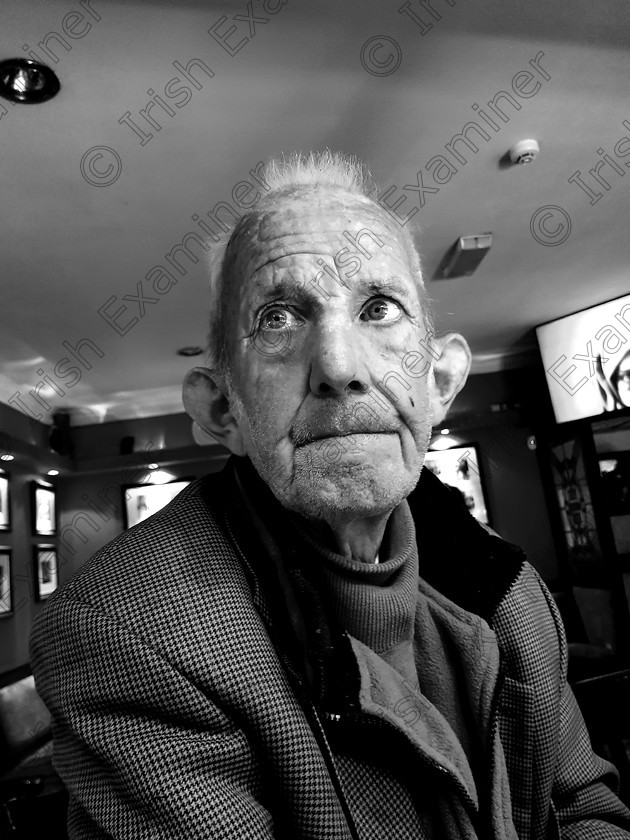 Anthony 
 Anthony Brosnan deciding if he wants a whiskey or cup of tea. Hendersons Bar, Firies, Co Kerry Picture: Damien Brown