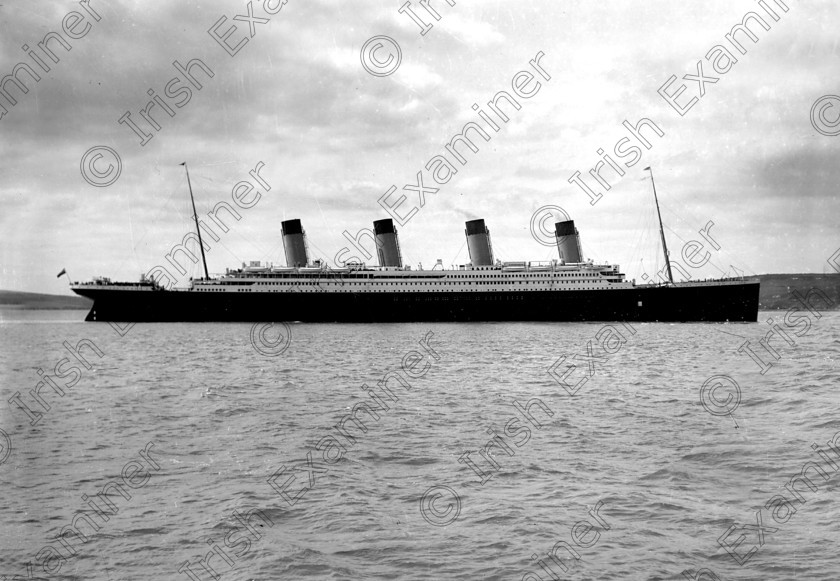 432458 
 Please archive -
In April, 1912 the RMS Titanic called to the port of Queenstown (Cobh) on her maiden voyage. The pride of the White Star Line arrived at Roche's Point at 11.30 a.m. A total of 123 passangers embarked at Queenstown. Three days later the liner struck an iceberg. Of the 2228 passangers and crew aboard only 705 survived. Picture shows the doomed liner off Roche's Point. 
Ref.114/115 11/04/1912
Old black and white ships liners disasters