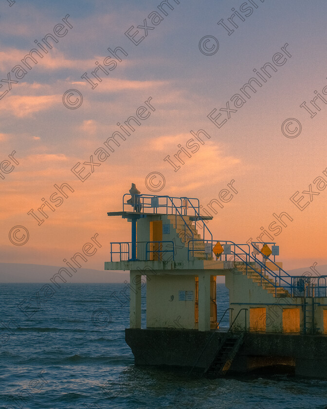 Salthill Spring (3 of 3) 
 A woman watches the sun set from Blackrock Diving Tower, Salthill, Co. Galway