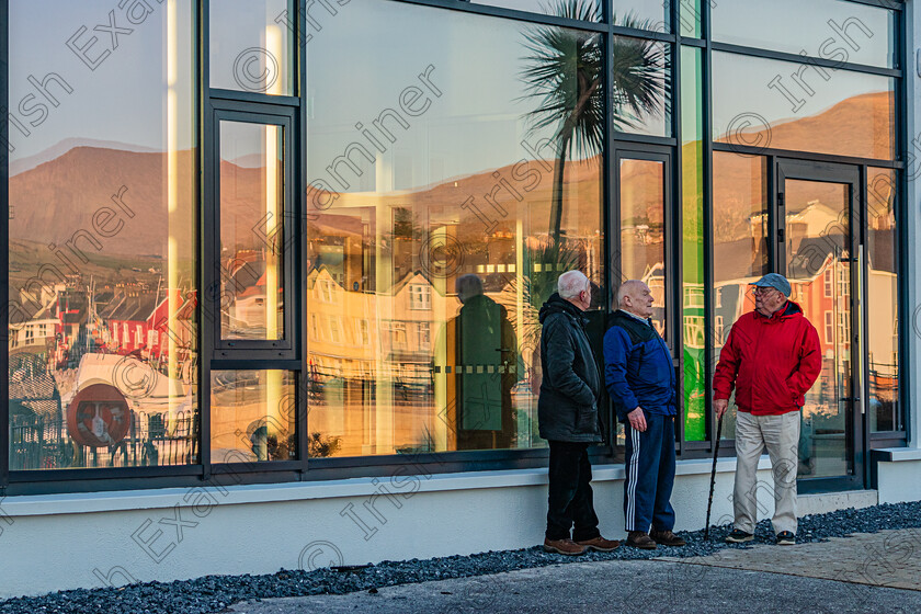 Reflections at Dingle Marina Centre-5293 
 Local men Peter lambe,Eugene Devane and Michael McNamara " reflecting" on the affairs of the nation at Dingle Marina on Sunday January 16th 2022,in anticipation of the imminent easing of restrictions.Photo by : Noel O Neill 
 Keywords: Dingle, Esk, Tower, church, rambles, reflections