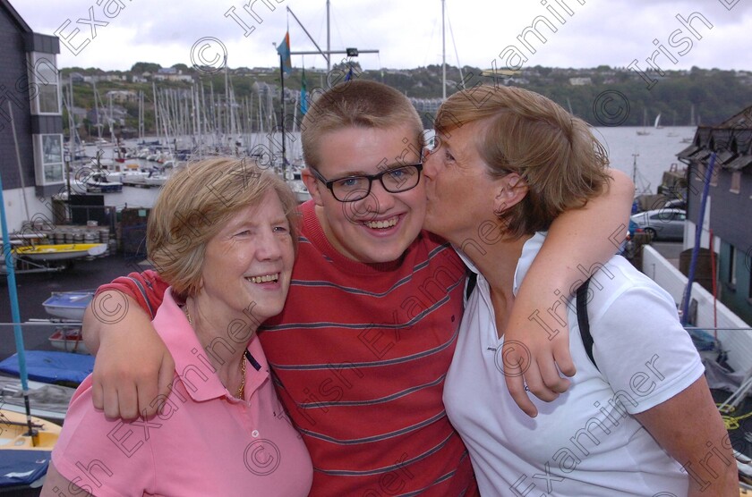 Astrid-ship-14 
 EE XX job 24/07/2013.
Astrid rescue; 17yo trainee sailor Christopher Hopcraft, Ballincollig with grandmother Pauline Keane and mum Siobhan Hopcraft, from Ballincollig re-united at Kinsale Yacht Club after the successful, dramatic rescue of all thirty people from the tall ship.
Ref - Eoin English / Ann Murphy copy.
Pic; Larry Cummins,
Evening Echo staff
NUJ Photographer, Member of the Press Photographers' Association of Ireland.
www.eveningecho.ie