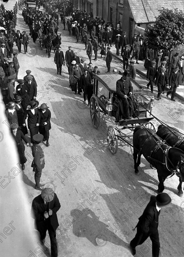 425856 
 The Cunard liner Lusitania, carrying 1,918 passangers and crew, was hit by a torpedo fired from a German U-boat at 2.00 p.m. on the afternoon of May, 7th., 1915. 764 people survived the sinking which took place10 miles off the Old Head of Kinsale. A total of 169 of the 289 bodies recovered from the Lusitania were buried at the Old Church (Clonmel) Cemetery in Cobh (Queenstown). Picture shows the funeral cortege to the cemetery on Monday, May 10th., 1915. Ref. 44
Old black and white war ships boats tragedies funerals burials