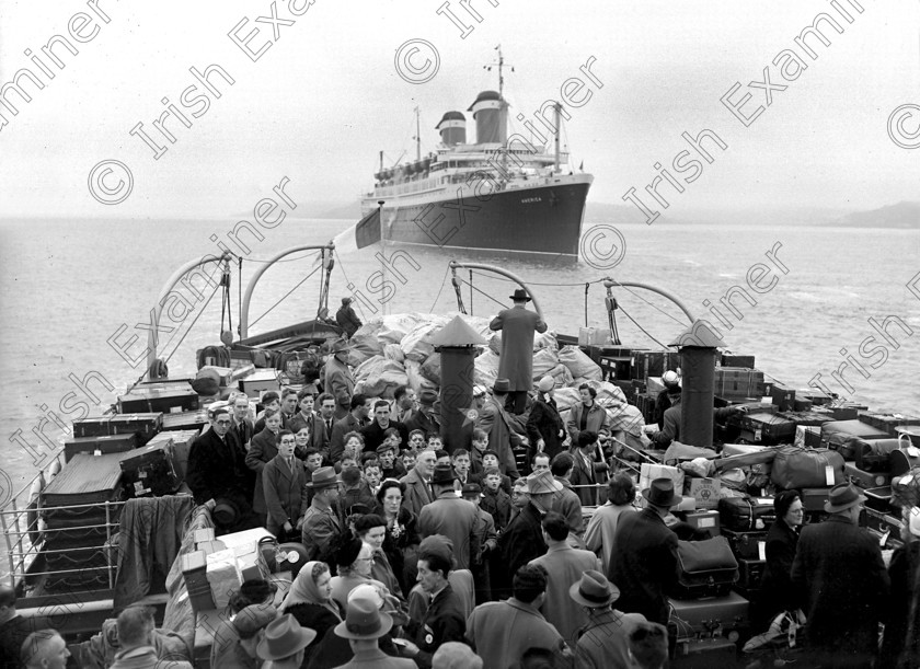 857785 857785 
 For 'READY FOR TARK'
Passangers from the liner 'America' sail for Cobh aboard a tender. 25/07/1953 Ref. 366G Old black and white ships