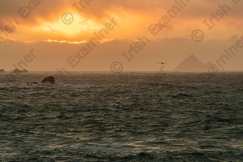 Noel O Neill Clogher -Dec 2023-1498-Enhanced-NR 
 An Tiaracht,one of the Blasket Islands west of Dingle Co Kerry as the sun was setting on a wild and cloudy day.Photo taken Friday Dec 22nd 2023 by: Noel O Neill 
 Keywords: Clogher