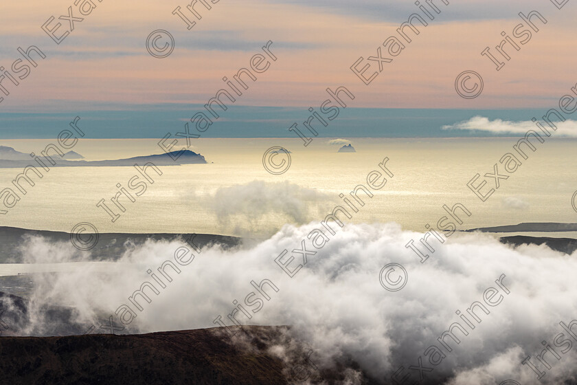 Skelligs from Brandon-1899 
 Sceilig Mhichil and Sceilig Beag in the distance taken from the slopes of Mount Brandon Dingle in March 2021 - by Noel O Neill 
 Keywords: Brandon, Cloud inversion, Skelligs