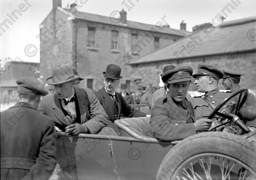 1176065 
 Members of the Irish Free State Army take over a ruined Michael (Collins) Barracks, Old Youghal Road, Cork at the conclusion of the Civil War in 1923. In bowler hat is President of the Executive Council of Ireland William (W.T.) Cosgrave Ref. 1549 old black and white soldiers troops