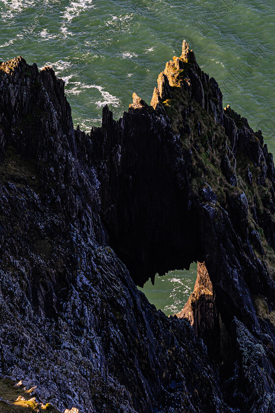 Bulls Head Dingle-1593-2 
 Spyhole at Bulls Head cliff face Kinard Lispole ,east of Dingle Co Kerry .Photo by: Noel O Neill 
 Keywords: Bulls Head, LYC, gap, hole, rock