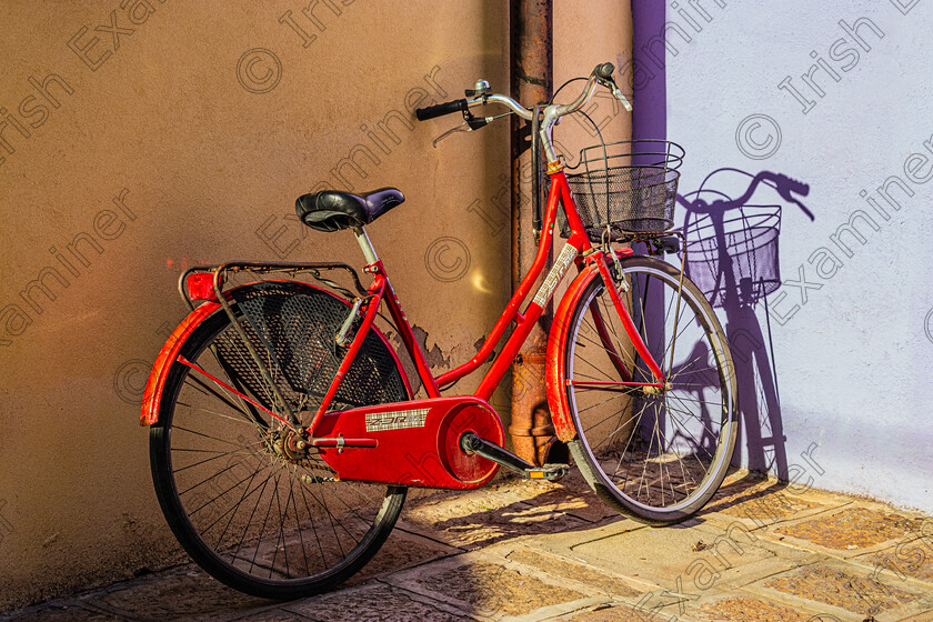 Burano bike reflection-1204 
 A lone bicycle in the town of Burano Venice in Nov 2023.Photo by: Noel O Neill 
 Keywords: Burano, KCC, Venice, reflections