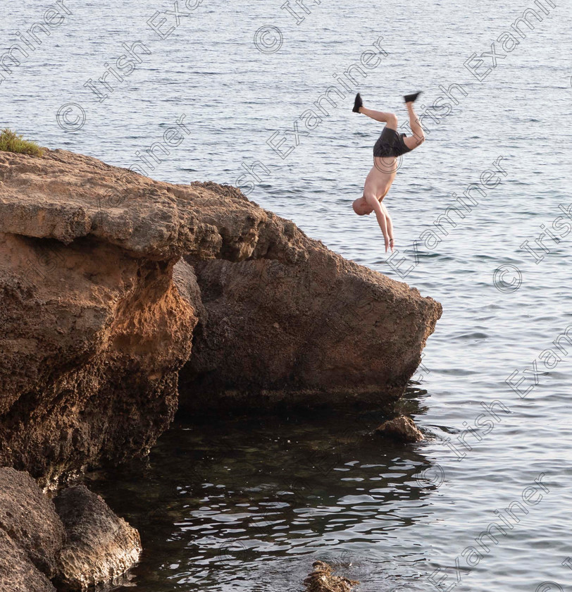 Tombstoning 
 "Tombstoning"-taken in Santa Ponsa last week while out for a 
walk. Man did reverse drive off top of cliff and barely missed both large rocks In water below. photo: Ray Shanahan