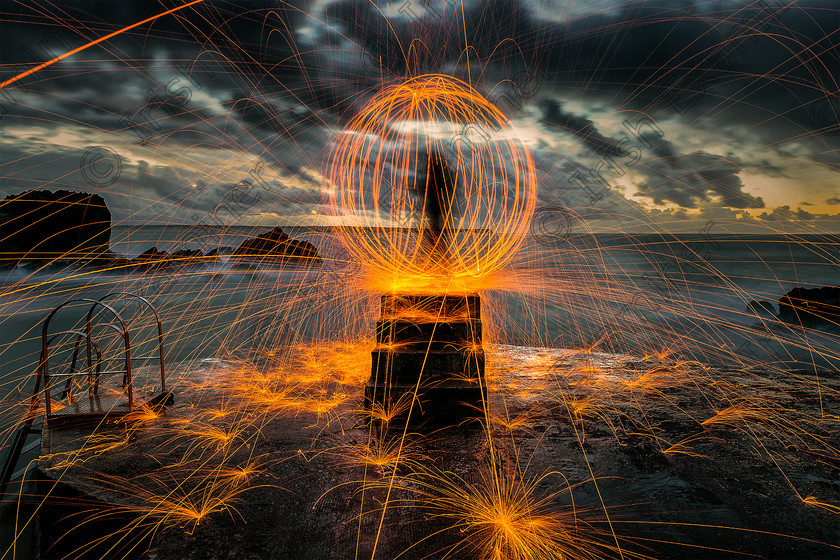 IMG 1509-Edit 
 Who: Shot and performed by Aldo Selvi
What: Pre-dawn steel wool spin. 
Where: Shot in at Newtown Cove, Tramore, Co. Waterford. 
When: 15th October 2016 
How: Effect is made by placing steel wool in a whisk, attached to a chain and spinning it to create the desired effect
