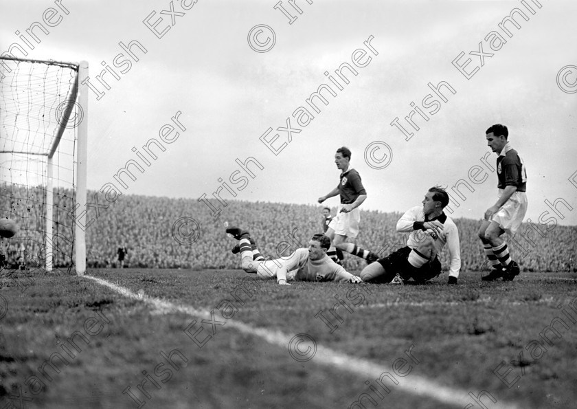 428738 
 The ball goes outside the Irish post in the Ireland v. Germany soccer international at Dalymount Park, Dublin. Included is Florrie Burke of Cork Athletic. Ref. 231E 17/10/1951

100 Cork Sporting Heroes
Old black and white