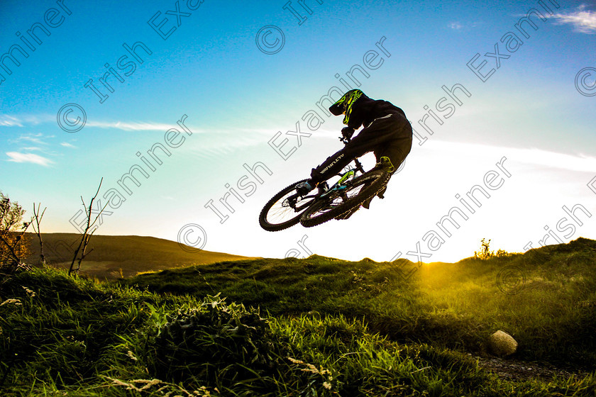 IMG-0383-Edit-Edit 
 Oliver Davy aged 15, Dublin, hits a jump on the new mountain biking trails at Glencullen Adventure Park with the sun setting behind the Wicklow Mountains, Co Dublin. Picture: Nick Elliott