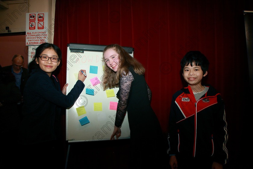 Feis31012018Wed43 
 43
Megan Chan and Helen Ruthledge signing the How Did It Go? Board watched by Bryan Chan all from Blackrock.
 Instrumental Music; Class: 236 “The Shanahan & Co. Perpetual Cup”: Advance Violin, one movement from a Concerto; Feis Maitiú 92nd Festival held in Fr. Matthew Hall. EEjob 31/01/2018. Picture: Gerard Bonus.