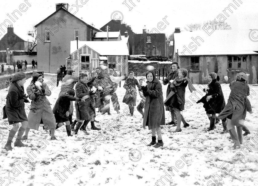 blackrock village-(1) 
 Snow scene after Sunday mass at Blackrock, Cork 02/02/1941 Ref. 599C 
 Keywords: Old black and white winter children