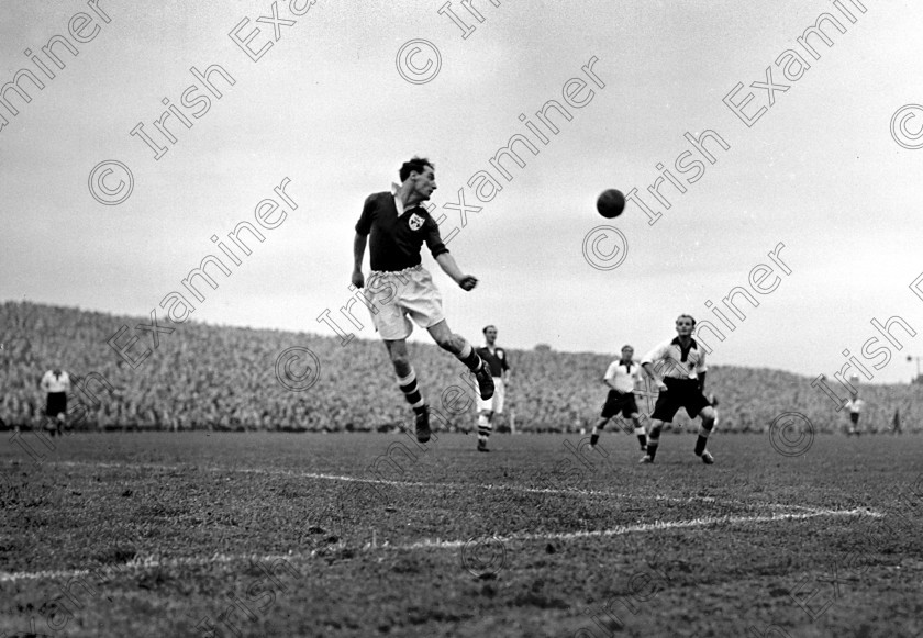 428739 
 Florrie Burke, Cork Athletic, clears the ball during Ireland v. Germany soccer international at Dalymount Park, Dublin. Ref. 231E 17/10/1951

100 Cork Sporting Heroes
Old black and white