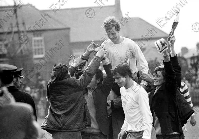 429322 
 Cork Hibernians hero Miah Dennehy is chaired from the field by Hibs supporters after his team won the League of Ireland play-off decider against Shamrock Rovers at Dalymount Park, Dublin. Also in the picture is Hibs battle scarred centre forward Tony Marsden.
26/04/1971 Ref. 126/3
100 Cork Sporting Heroes Old black and white