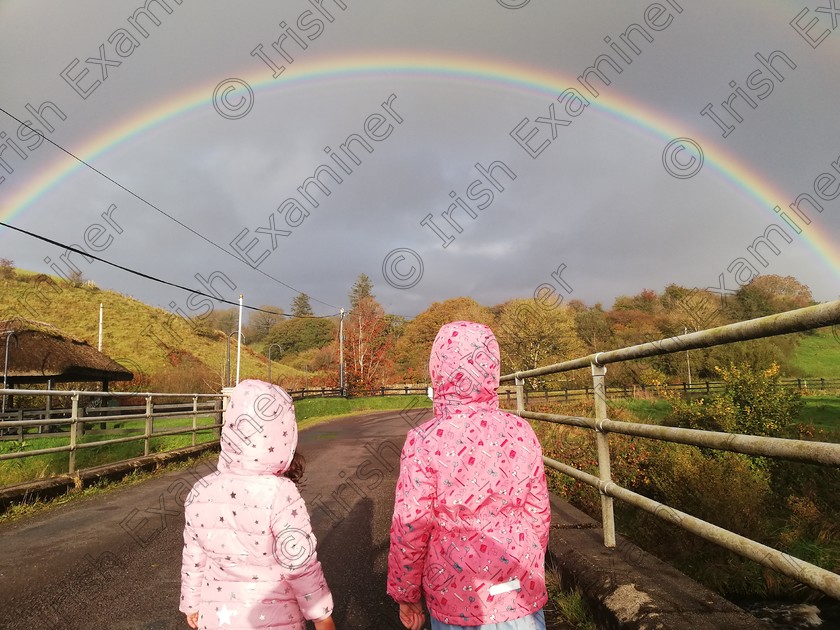 IMG 20201021 165705 
 First cousins Leah Walsh Dawoud & Shauna Walsh , Co. Kerry crossing the bridge where the 3 counties meet (Kerry, Limerick & Cork), mesmerized by a beautiful rainbow between the showers, on Wednesday 21st October 2020 - eve of second lockdown.
Photo: Genevieve Flanagan Walsh
