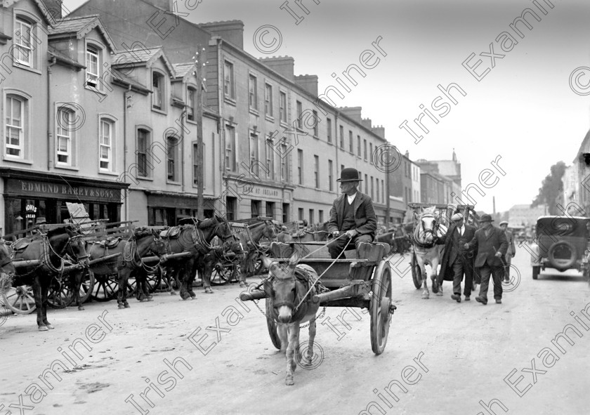871092 871092 
 For 'READY FOR TARK'
Main Street, Midleton on fair day 10/08/1931 Ref. 743A Old black and white fairs streets donkeys carts farmers east cork