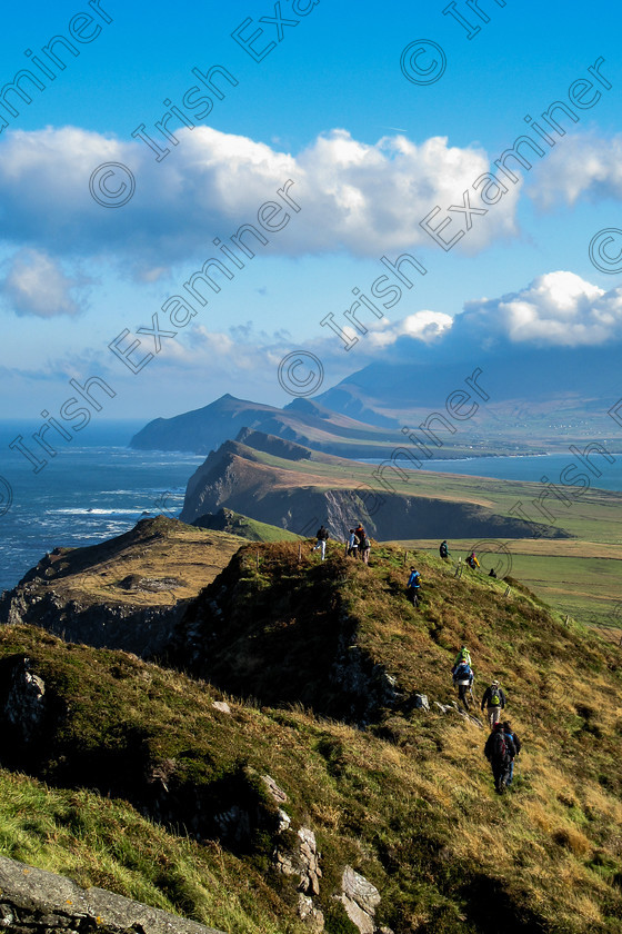 Three Sisters Oct 2016-4982 
 Dingle Hillwalking Club Members walking the ridges from Sybil Head (recent Star Wars set location) to the "Three Sisters" with Ballydavid Head and Mount Brandon (under cloud) in the distance.Photo taken Sunday Oct 23rd 2016.Photographer: Noel O Neill 
 Keywords: DHC, Three Sisters, landscape
