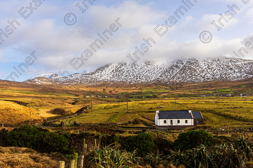 Brandon range from Cuas-1399 
 A snow capped Brandon mountain range co Kerry under cloud, taken from Cuas / Brandon Creek, west of Dingle Co Kerry.Photo by: Noel O Neill 
 Keywords: Brandon, house