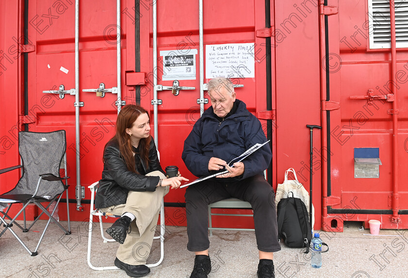 LC-bruce-fans-10 
 FEATURES IRISH EXAMINER - Irish fans Alice Coppen, from Wexford and Jim Conway from Limerick look over a book of photos of 'The Boss' while attending the roll-call. Fans gathered for 10am roll call on Wednesday morning. They are queuing for priority admission to the Bruce Springsteen and the E Street Band stadium concert at Supervalu Pairc Ui Chaoimh, Cork on Thursday. ,'Roll-Call' is at the 5 Points Coffee Kiosk at Marina Park, for fans who want to secure front of stage access in the pit. Fans have to attend three roll-calls per day to maintain their position in the queue and will be escorted into the stadium venue ahead of the public gate opening, ensuring they have best positions at the barrier at the front of the stage. Some fans attending the roll call had travelled from New York, South Africa, Sweden, The Netherlands, Japan, Italy, Barcelona, and the UK as well as dedicated Irish fans. Pic Larry Cummins