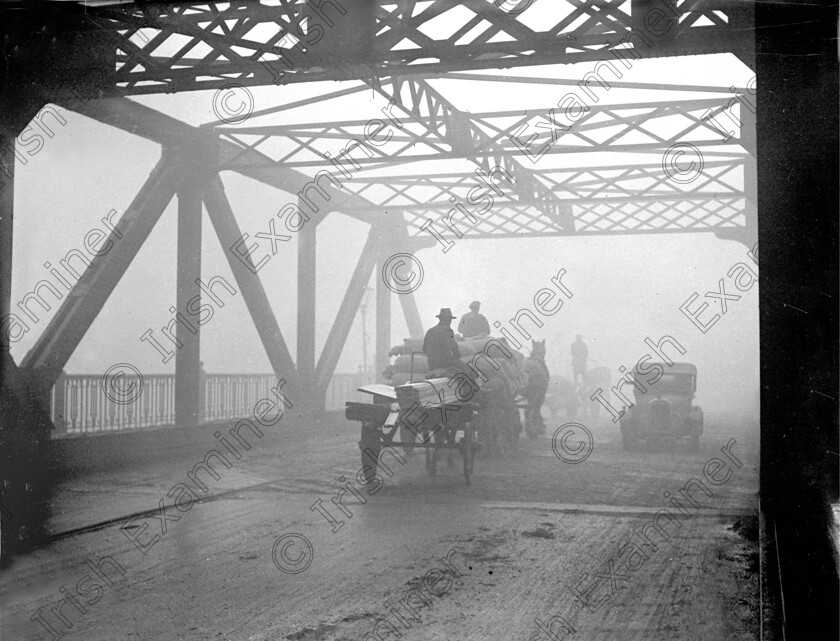 822724 822724 
 For 'READY FOR TARK'
Clontarf Bridge shrouded in fog 04/01/1934 Ref. 240B Old black and white winter weather horse and carts smog