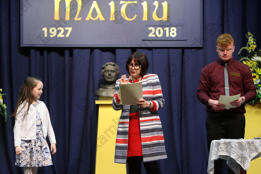 Feis25032018Sun28 
 28
Adjudicator: Maeve O’Donoghue reading out Molly O’Driscoll’s report as she received 3rd place with stagehand Sean O’Shea.
 Speech and Drama Class: 365: Solo Verse Speaking Girls 10 Years and Under Section 5 Feis Maitiú 92nd Festival held in Fr. Mathew Hall. EEjob 25/03/2018 Picture: Gerard Bonus