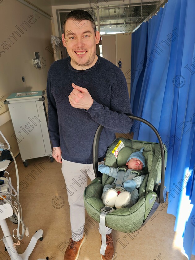 James Grandfield New Beginnings 
 New arrival. Myself holding the car seat with our New bundle of joy, baby Daniel. New beginnings.