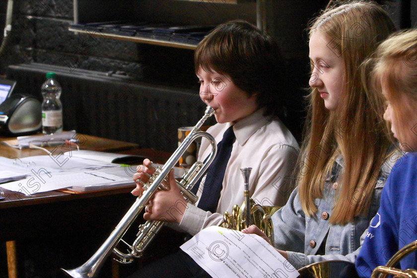 Feis13022019Wed01 
 1
Performer Ben Greenham tuning up back stage watched by Ella Morrison and Ella McCarthy.

Class: 205: Brass Solo 12Years and Under Programme not to exceed 5 minutes.

Class: 205: Brass Solo 12Years and Under Programme not to exceed 5 minutes.