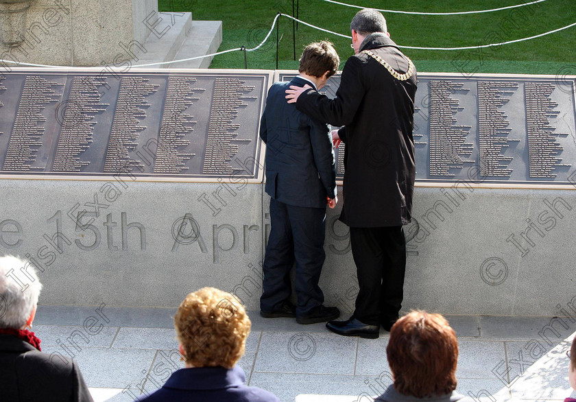 ULSTER Titanic 123878 
 Jack Martin 12, a descendant of Dr John Simpson who perished on the Titanic, with Belfast Lord Mayor Niall O'Donnghaile after unveiling a plaque in the new memorial garden at Belfast City Hall on the 100th anniversary of the sinking of the Titanic. PRESS ASSOCIATION Photo. Picture date: Sunday April 15, 2012. A minute's silence was held as the memorial was opened in Belfast. A great, great nephew of the ship's doctor helped unveil bronze plaques listing more than 1,500 passengers, crew and musicians who died when the liner struck an iceberg and sank in the North Atlantic on April 15 1912. See PA story ULSTER Titanic. Photo credit should read: Paul Faith/PA Wire