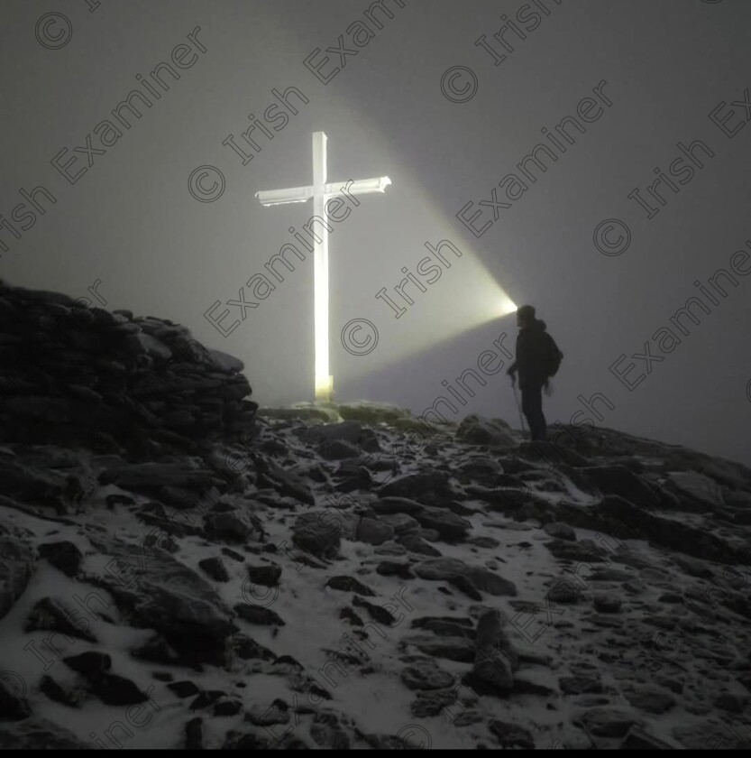 inbound6593076310854437348 
 Paul Allen, my husband who is in his happy place when he hikes up Carrauntoohil. He wanted to see sunrise last Wednesday morning December 11th, so off he went to Kerry at 2.30am from Limerick with his brother Stephen. 
It was around 7.15am when they reached the summit, but there was no view from the top because of fog,, but Paul took an amazing shot with his iPhone 12 of the cross gat the top of Ireland glowing under the light of his brothers head torch. I really think this shot is worthy of a prize!