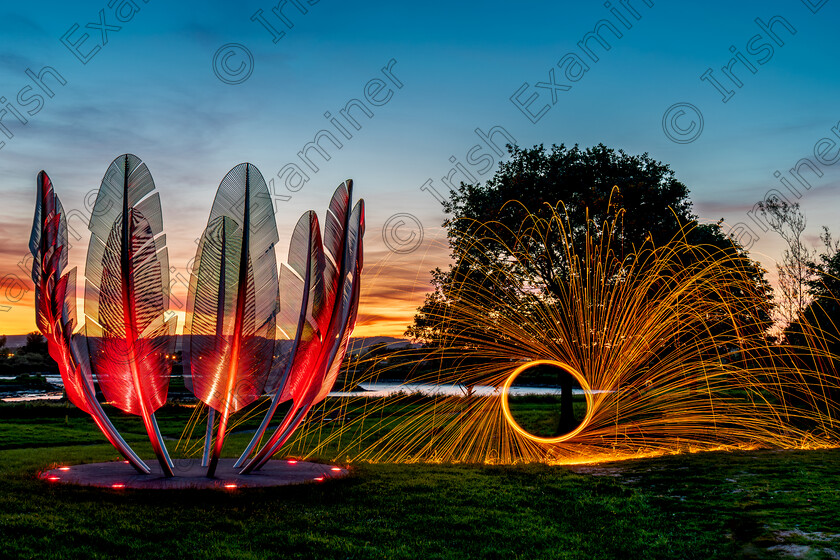 Spitting Fire 
 Spitting Fire - steel wool lit on fire next to the Kindred Spirits monument at Bailick Park, Midleton. Taken in May this year.