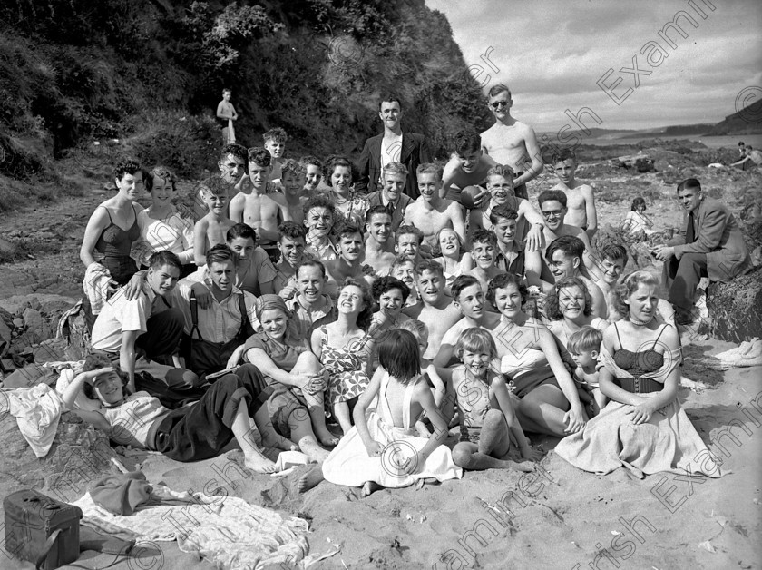 591669 
 Please archive -
Crosshaven holiday group 02/08/1953 Ref. 199G Old black and white beaches strands holidaymakers