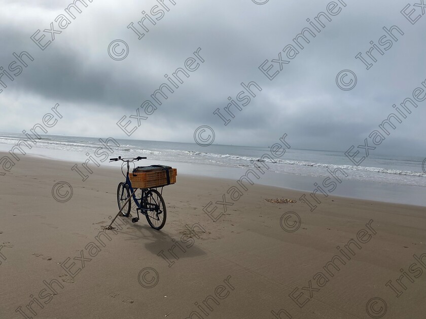 6F6DB2A9-4C27-46A3-88E3-D87BF579FF8A 
 Bike on a foggy beach in Portugal, propped up by its owner, who is in the water digging for cockles!