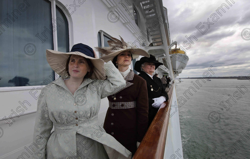 BRITAIN Titanic 32 
 In this photo taken Sunday, April 8, 2012, passengers from the United States, names not given, wearing period costumes, look out from aboard the MS Balmoral Titanic memorial cruise ship as it sails from Southampton, England. A cruise carrying relatives of some of the more than 1,500 people who died aboard the Titanic nearly 100 years ago set sail from England on Sunday to retrace the ship's voyage, including a visit to the location where it sank. (AP Photo/Lefteris Pitarakis)