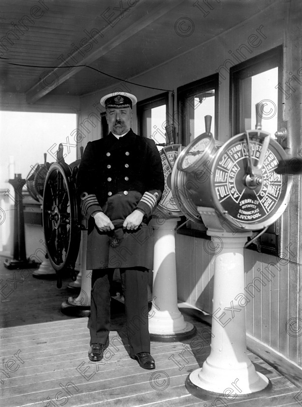 432459 
 Please archive -
In April, 1912 the RMS Titanic called to the port of Queenstown (Cobh) on her maiden voyage. The pride of the White Star Line arrived at Roche's Point at 11.30 a.m. A total of 123 passangers embarked at Queenstown. Three days later the liner struck an iceberg. Of the 2228 passangers and crew aboard only 705 survived. Pictured is Captain Smith, skipper of the Titanic, pictured on the bridge of the liner.
Ref.114/115 11/04/1912
Old black and white ships liners disasters