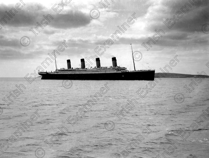 432455 
 Please archive -
In April, 1912 the RMS Titanic called to the port of Queenstown (Cobh) on her maiden voyage. The pride of the White Star Line arrived at Roche's Point at 11.30 a.m. A total of 123 passangers embarked at Queenstown. Three days later the liner struck an iceberg. Of the 2228 passangers and crew aboard only 705 survived. Picture shows the doomed liner off Roche's Point. 
Ref.114/115 11/04/1912
Old black and white ships liners disasters