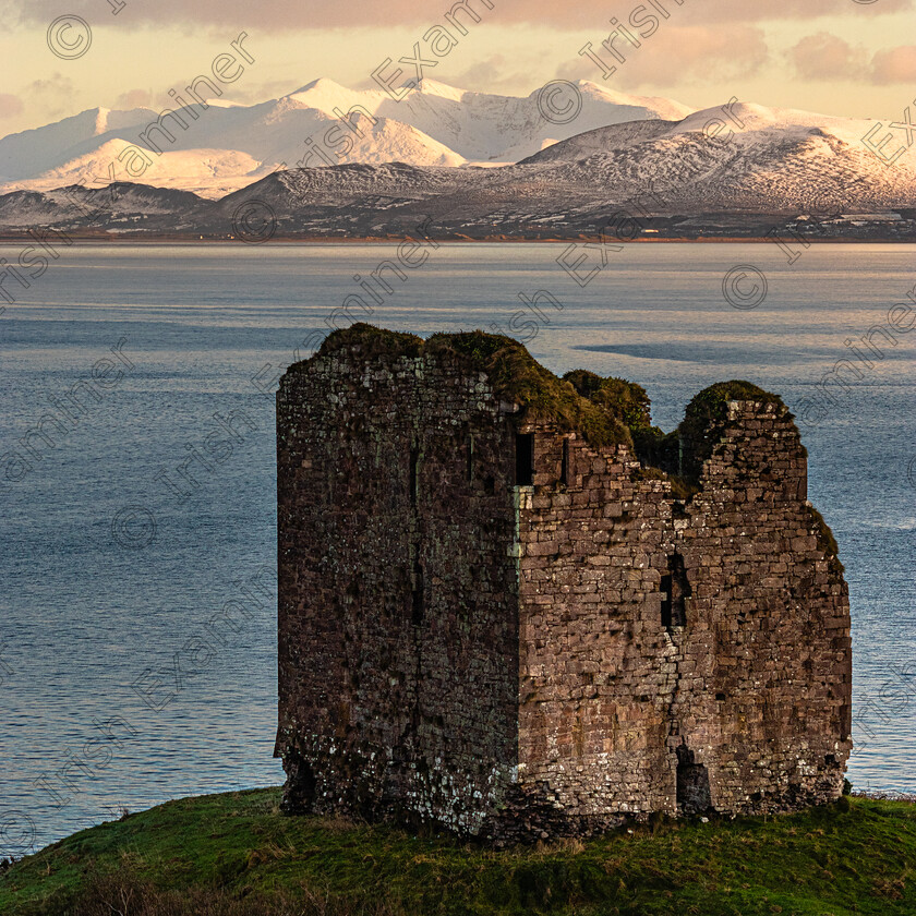 Minard Castle-reeks-snow-3852 
 Minard Castle Lispole Co Kerry during the recent cold snap,with carrauntoohil and the Magillicuddy Reeks under snow in the distance,across Dingle Bay.Photo by: Noel O Neill 
 Keywords: Lispole, Minard, Reeks, snow