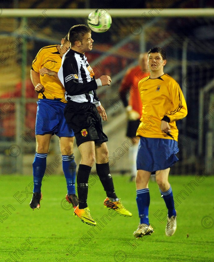 1584976 1584976 
 Midleton's Ricky Getting goes high with College Corinthians Peter Morehead and Eoin Murphy during the Keane cup final against Midleton FC at Turners Cross
Picture: Eddie O'Hare