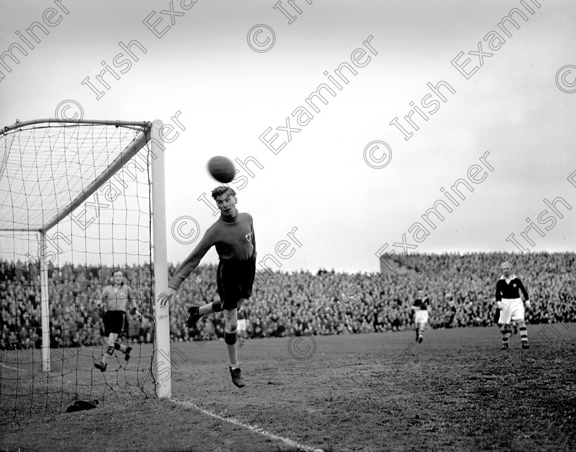 320466 
 Action from the all Cork F.A.I. Cup Final at Dalymount Park, Dublin between Evergreen United and Cork Athletic. Evergreen goalkeeper Barrett watches the ball go past the post, on extreme right is Athletic's Raich Carter. 26/4/1953 Ref. 990E
Echo Book (Sport)